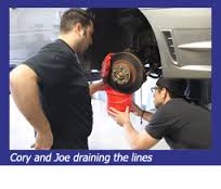 cory-and-joe-draining-the-linesStop-Tech WRX Big Brake Kit